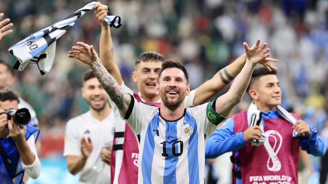 LUSAIL CITY, QATAR - NOVEMBER 26: Lionel Messi (10) of Argentina celebrates with his teammates after winning the FIFA World Cup Qatar 2022 Group C match between Argentina and Mexico at Lusail Stadium on November 26, 2022 in Lusail City, Qatar.