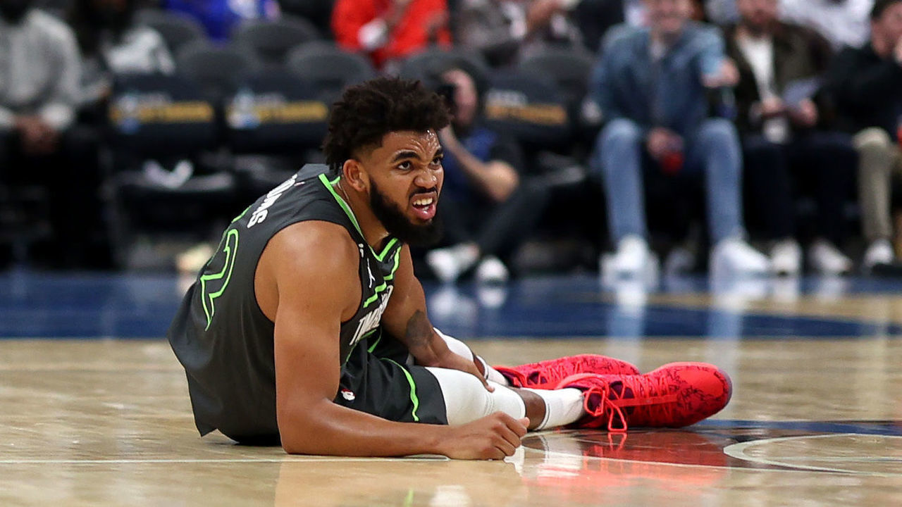 WASHINGTON, DC - NOVEMBER 28: Karl-Anthony Towns #32 of the Minnesota Timberwolves reacts after being injured in the third quarter against the Washington Wizards at Capital One Arena on November 28, 2022 in Washington, DC.