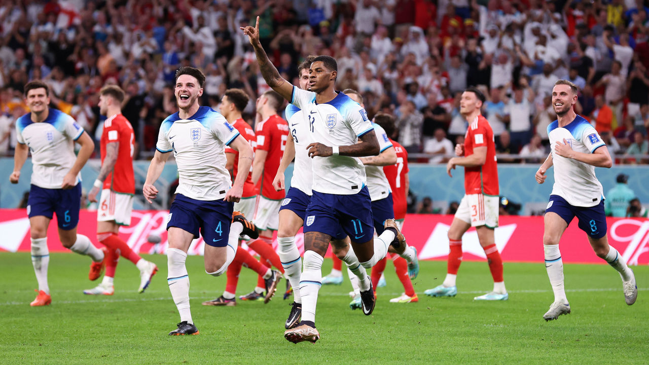 DOHA, QATAR - NOVEMBER 29: Marcus Rashford of England celebrates after scoring his side's first goal during the FIFA World Cup Qatar 2022 Group B match between Wales and England at Ahmad Bin Ali Stadium on November 29, 2022 in Doha, Qatar.