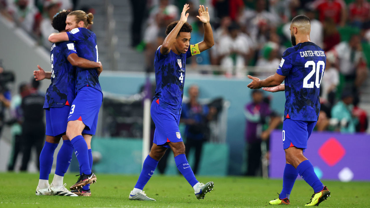 DOHA, QATAR - NOVEMBER 29: Tyler Adams of USA Cameron Carter Vickers of USA celebrates as Christian Pulisic of USA scores their first goal during the FIFA World Cup Qatar 2022 Group B match between IR Iran and USA at Al Thumama Stadium on November 29, 2022 in Doha, Qatar.