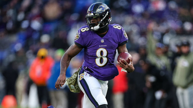 BALTIMORE, MD - NOVEMBER 20: Lamar Jackson #8 of the Baltimore Ravens carries the ball against the Carolina Panthers during the first half at M&T Bank Stadium on November 20, 2022 in Baltimore, Maryland.
