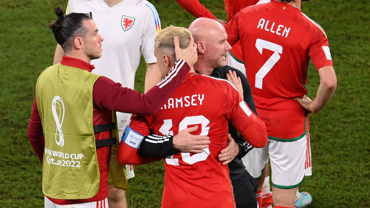 DOHA, QATAR - NOVEMBER 29: Rob Page, Head Coach of Wales, embraces Aaron Ramsey (3L) and Gareth Bale after the 3-0 win during the FIFA World Cup Qatar 2022 Group B match between Wales and England at Ahmad Bin Ali Stadium on November 29, 2022 in Doha, Qatar.