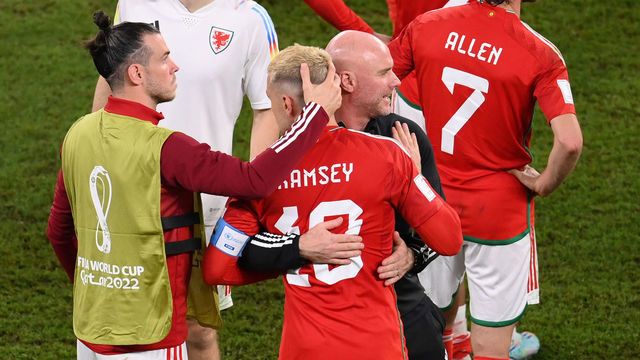 DOHA, QATAR - NOVEMBER 29: Rob Page, Head Coach of Wales, embraces Aaron Ramsey (3L) and Gareth Bale after the 3-0 win during the FIFA World Cup Qatar 2022 Group B match between Wales and England at Ahmad Bin Ali Stadium on November 29, 2022 in Doha, Qatar.
