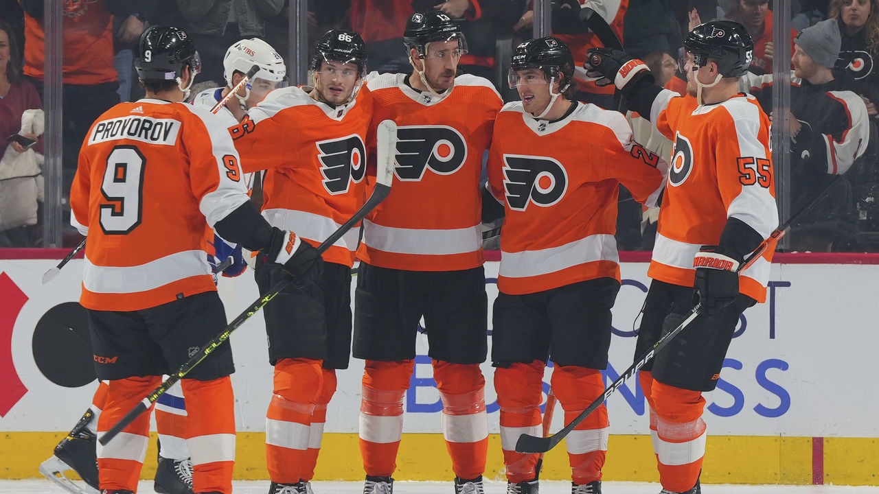 PHILADELPHIA, PA - NOVEMBER 29: Kevin Hayes #13 of the Philadelphia Flyers celebrates with Ivan Provorov #9, Joel Farabee #86, Lukas Sedlak #23, and Rasmus Ristolainen #55 after scoring a goal against the New York Islanders in the first period at the Wells Fargo Center on November 29, 2022 in Philadelphia, Pennsylvania.