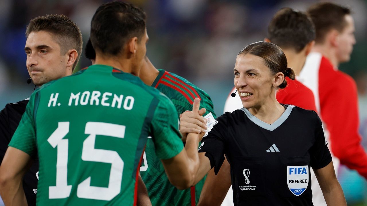 The 4th official Stephanie Frappart R reacts with Hector Moreno of Mexico prior to the Group C match between Mexico and Poland of the 2022 FIFA World Cup at Ras Abu Aboud 974 Stadium in Doha, Qatar, Nov. 22, 2022.