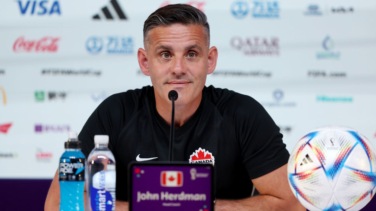 DOHA, QATAR - NOVEMBER 30: John Herdman, Head Coach of Canada, speaks during the Canada Press Conference at the Main Media Center on November 30, 2022 in Doha, Qatar.