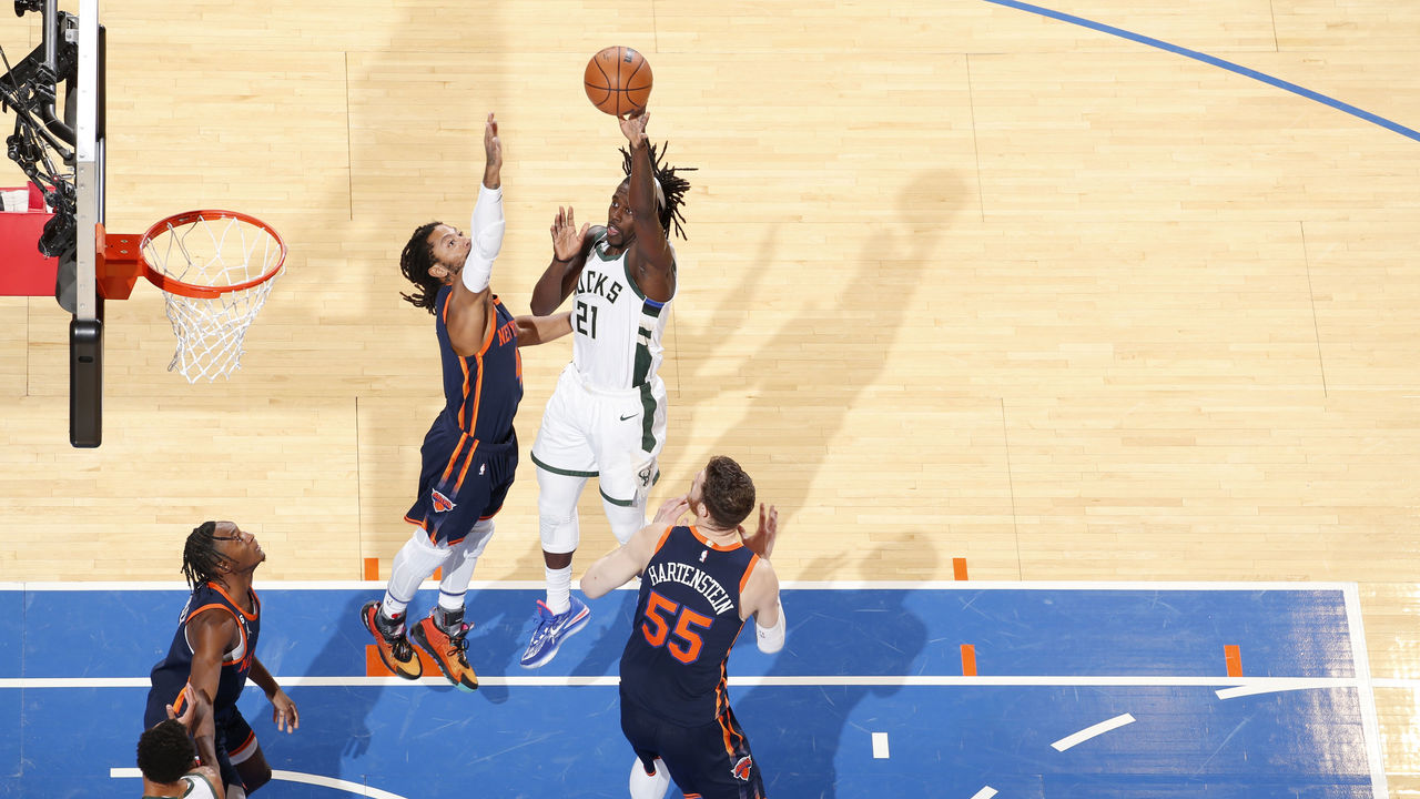 RJ Barrett of the New York Knicks hangs on the basket after dunking News  Photo - Getty Images