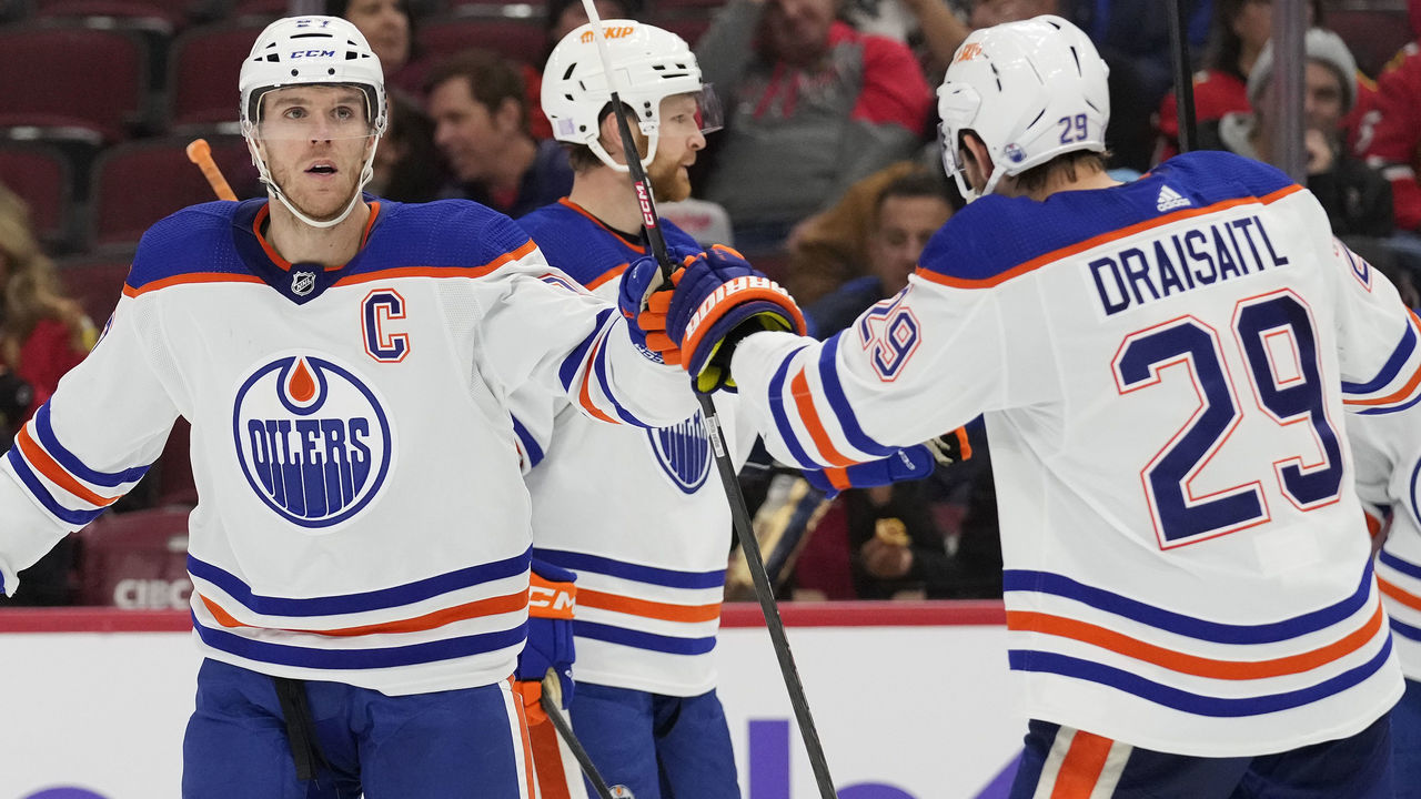CHICAGO, ILLINOIS - NOVEMBER 30: Connor McDavid #97 of the Edmonton Oilers celebrates with Leon Draisaitl #29 after scoring a goal against the Chicago Blackhawks during the third period at United Center on November 30, 2022 in Chicago, Illinois.