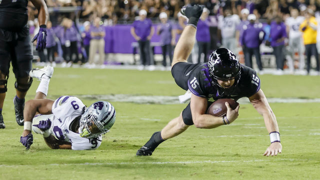 FORT WORTH, TX - OCTOBER 22: TCU Horned Frogs quarterback Max Duggan (15) gets tripped up and dives for a first down during the game between the TCU Horned Frogs and the Kansas State Wildcats on October 22, 2022 at Amon G. Carter Stadium in Fort Worth, Texas.