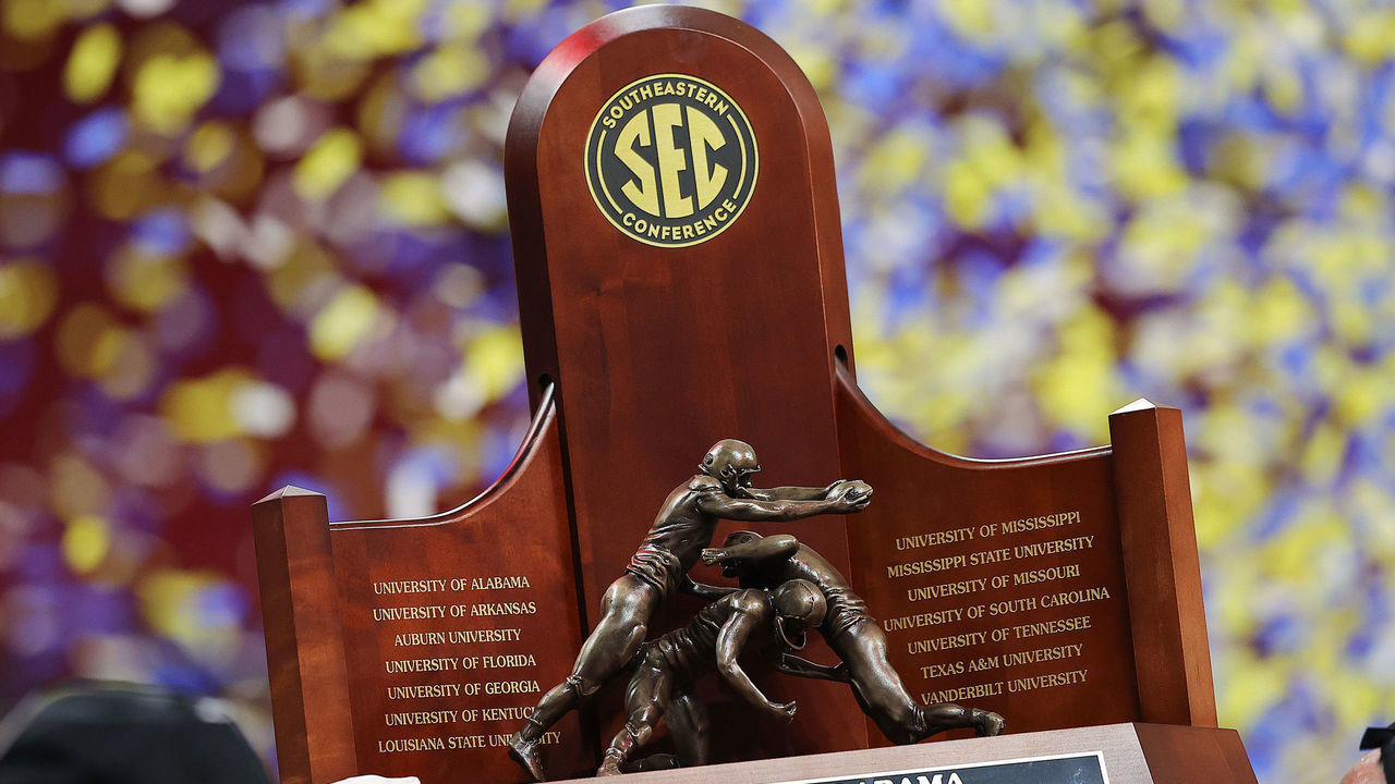 ATLANTA, GEORGIA - DECEMBER 04: The SEC Championship trophy is held after the Alabama Crimson Tide beat the Georgia Bulldogs in the SEC Championship game at Mercedes-Benz Stadium on December 04, 2021 in Atlanta, Georgia.