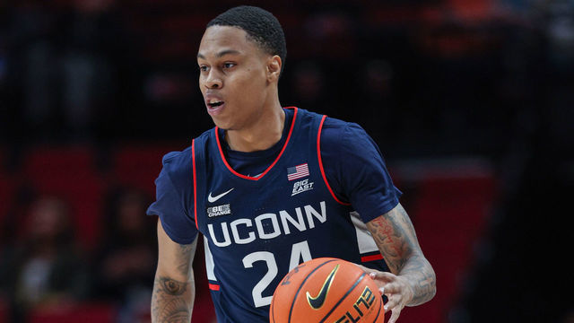 PORTLAND, OR - NOVEMBER 24: Jordan Hawkins #24 of the UCONN Huskies brings the ball up court during the game against the Oregon Ducks at Moda Center on November 24, 2022 in Portland, Oregon.