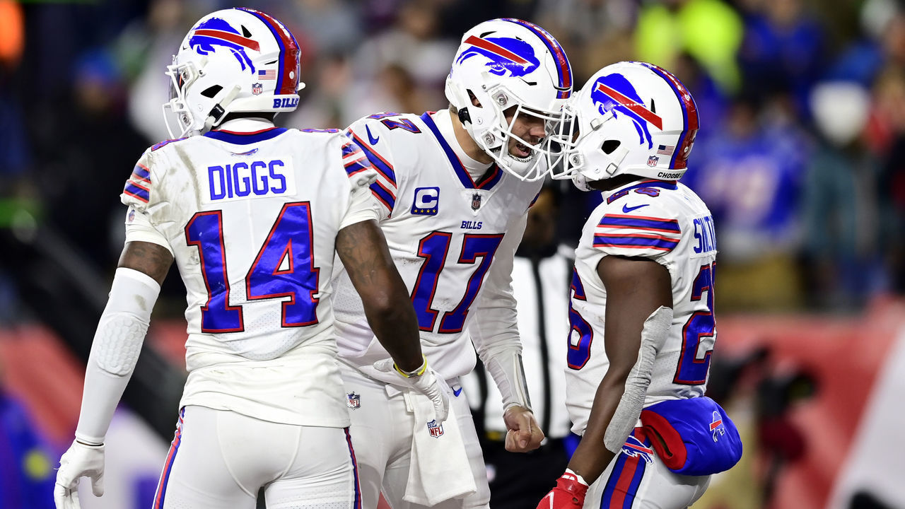 FOXBOROUGH, MASSACHUSETTS - DECEMBER 01: Quarterback Josh Allen #17 celebrates with running back Devin Singletary #26 of the Buffalo Bills after Singletary rushed for a fourth quarter touchdown against the New England Patriots at Gillette Stadium on December 01, 2022 in Foxborough, Massachusetts.