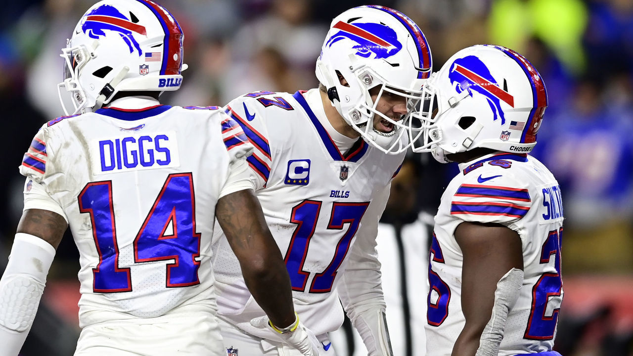 FOXBOROUGH, MASSACHUSETTS - DECEMBER 01: Quarterback Josh Allen #17 celebrates with running back Devin Singletary #26 of the Buffalo Bills after Singletary rushed for a fourth quarter touchdown against the New England Patriots at Gillette Stadium on December 01, 2022 in Foxborough, Massachusetts.