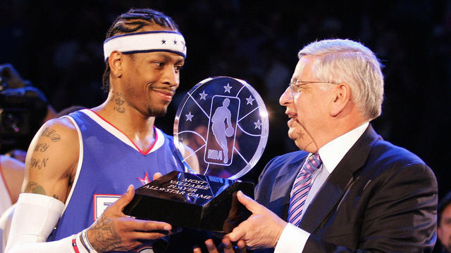 DENVER, UNITED STATES: NBA Commissioner David Stern (R) hands Allen Iverson of the Eastern Conference team the All-Star Most Valuable Player (MVP) trophy after the NBA All-Star game 20 February 2005 in Denver. The East defeated the West 125-115. AFP PHOTO/Don EMMERT