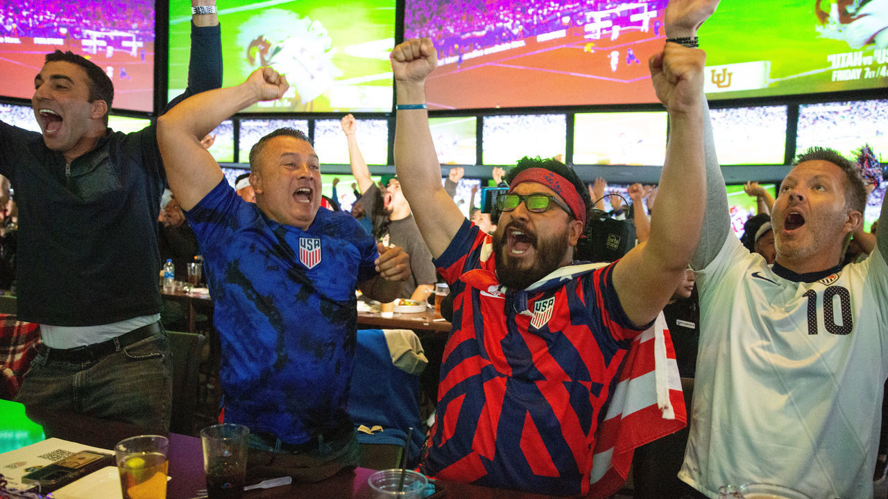LOS ANGELES, CA - NOVEMBER 29: Fans celebrate at Tom's Watch Bar at LA Live downtown as the U.S. team scores against Iran in the World Cup on Tuesday, Nov. 29, 2022 in Los Angeles, CA. (Jason Armond / Los Angeles Times via Getty Images)