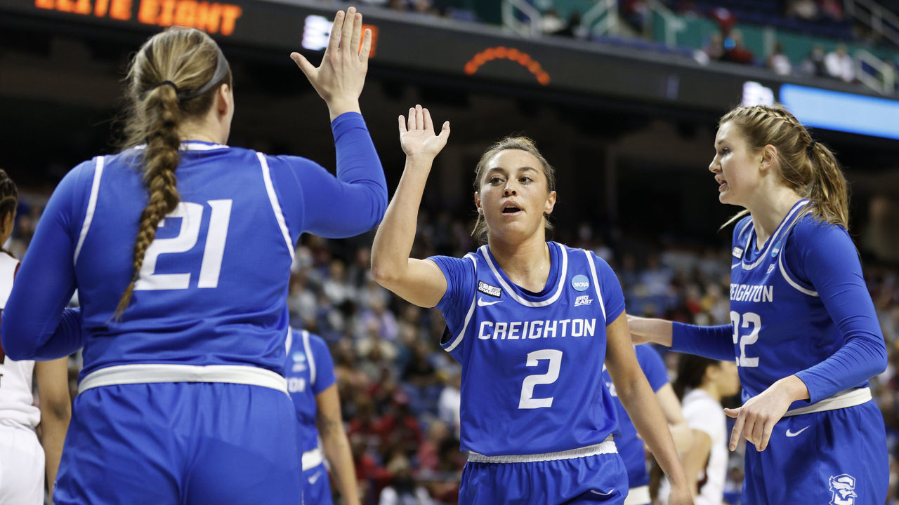 GREENSBORO, NORTH CAROLINA - MARCH 27: Tatum Rembao #2 celebrates with Molly Mogensen #21 of the Creighton Bluejays during the second half in the NCAA Women's Basketball Tournament Elite Eight Round against the South Carolina Gamecocks at Greensboro Coliseum Complex on March 27, 2022 in Greensboro, North Carolina.