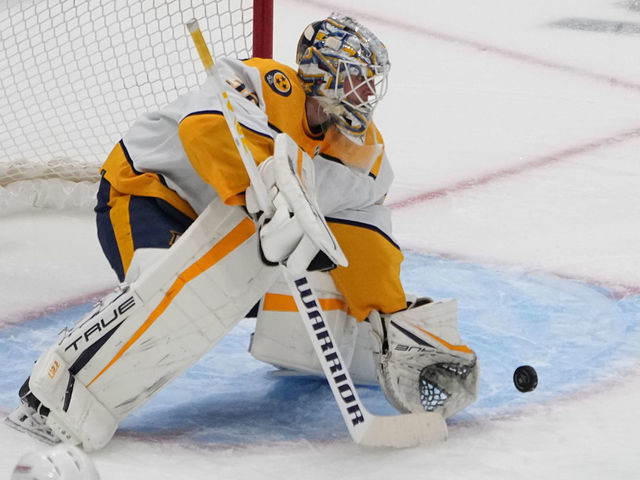 ELMONT, NY - DECEMBER 02: Nashville Predators Goalie Kevin Lankinen (32) makes a save during the first period of the National Hockey League game between the Nashville Predators and New York Islanders on December 2, 2022, at UBS Arena in Elmont, NY.