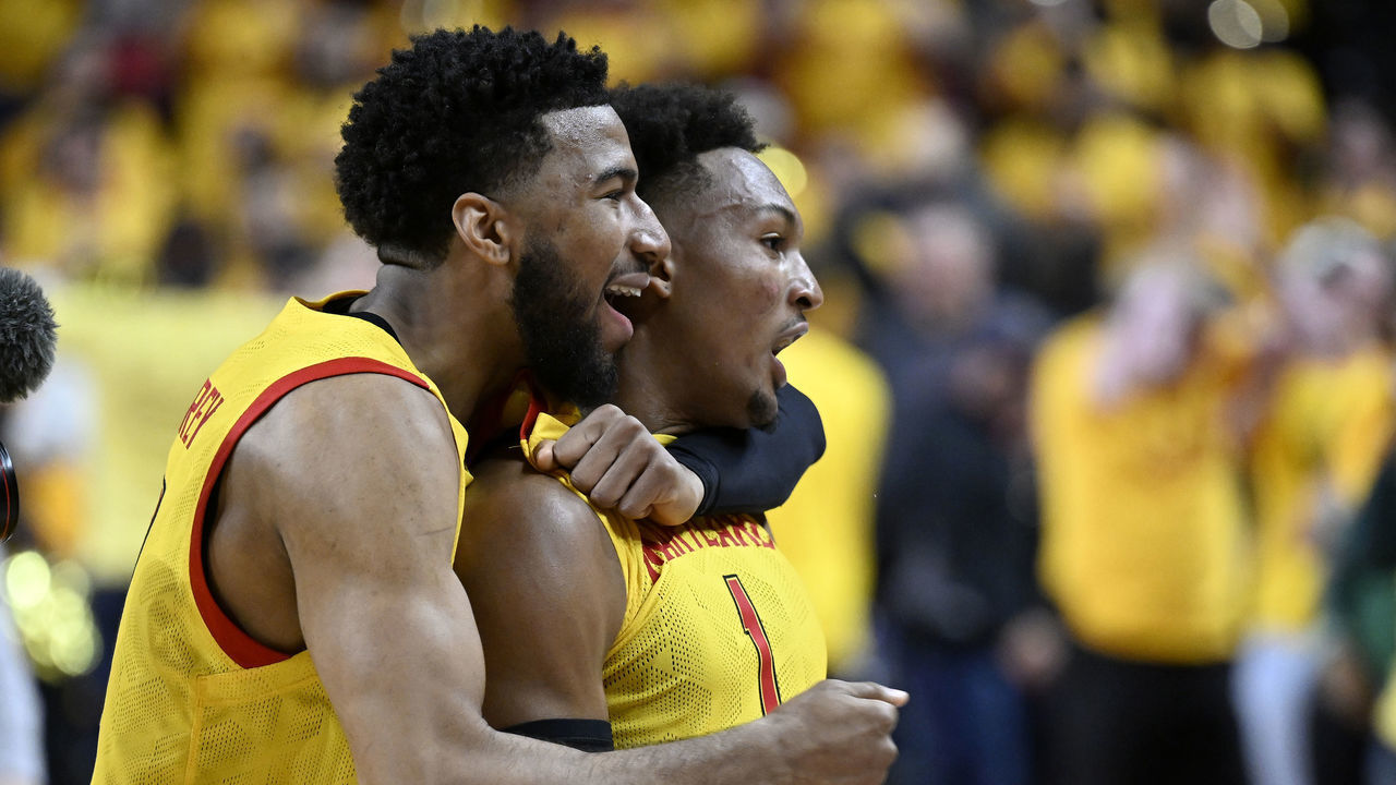 COLLEGE PARK, MARYLAND - DECEMBER 02: Jahmir Young #1 of the Maryland Terrapins celebrates with Don Carey #0 after a 71-66 victory against the Illinois Fighting Illini at Xfinity Center on December 02, 2022 in College Park, Maryland.