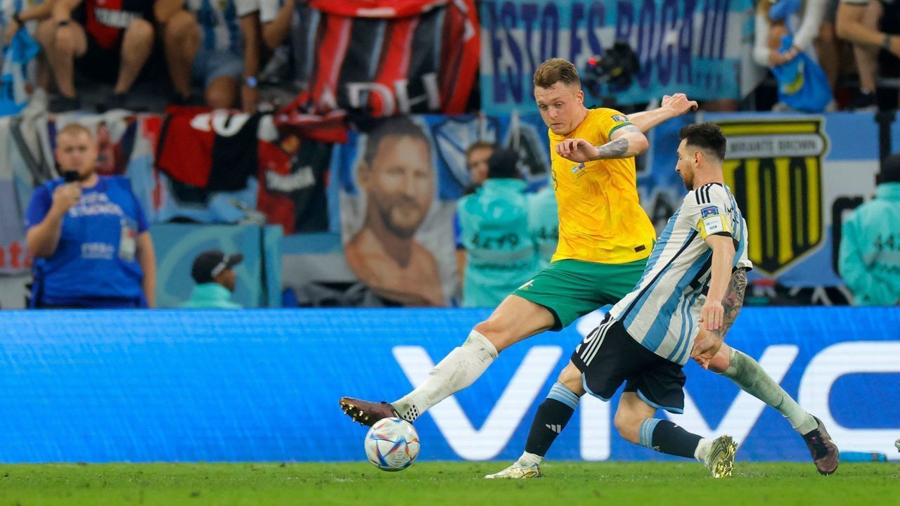 Argentina's forward #10 Lionel Messi and Australia's defender #19 Harry Souttar fight for the ball during the Qatar 2022 World Cup round of 16 football match between Argentina and Australia at the Ahmad Bin Ali Stadium in Al-Rayyan, west of Doha on December 3, 2022.