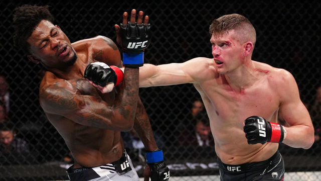 ORLANDO, FLORIDA - DECEMBER 03: (R-L) Stephen Thompson punches Kevin Holland in a welterweight fight during the UFC Fight Night event at Amway Center on December 03, 2022 in Orlando, Florida.