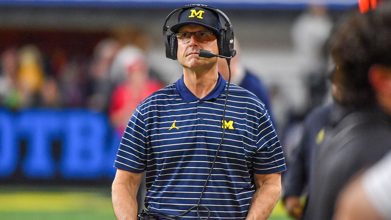 INDIANAPOLIS, INDIANA - DECEMBER 03: Head Football Coach Jim Harbaugh is seen walking up the sideline during the second half of the Big Ten football championship game against the Purdue Boilermakers at Lucas Oil Stadium on December 03, 2022 in Indianapolis, Indiana. The Michigan Wolverines won the game 43-22 over the Purdue Boilermakers.