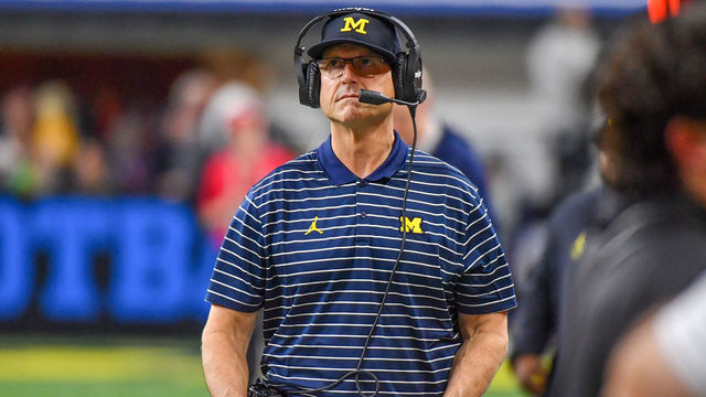 INDIANAPOLIS, INDIANA - DECEMBER 03: Head Football Coach Jim Harbaugh is seen walking up the sideline during the second half of the Big Ten football championship game against the Purdue Boilermakers at Lucas Oil Stadium on December 03, 2022 in Indianapolis, Indiana. The Michigan Wolverines won the game 43-22 over the Purdue Boilermakers.