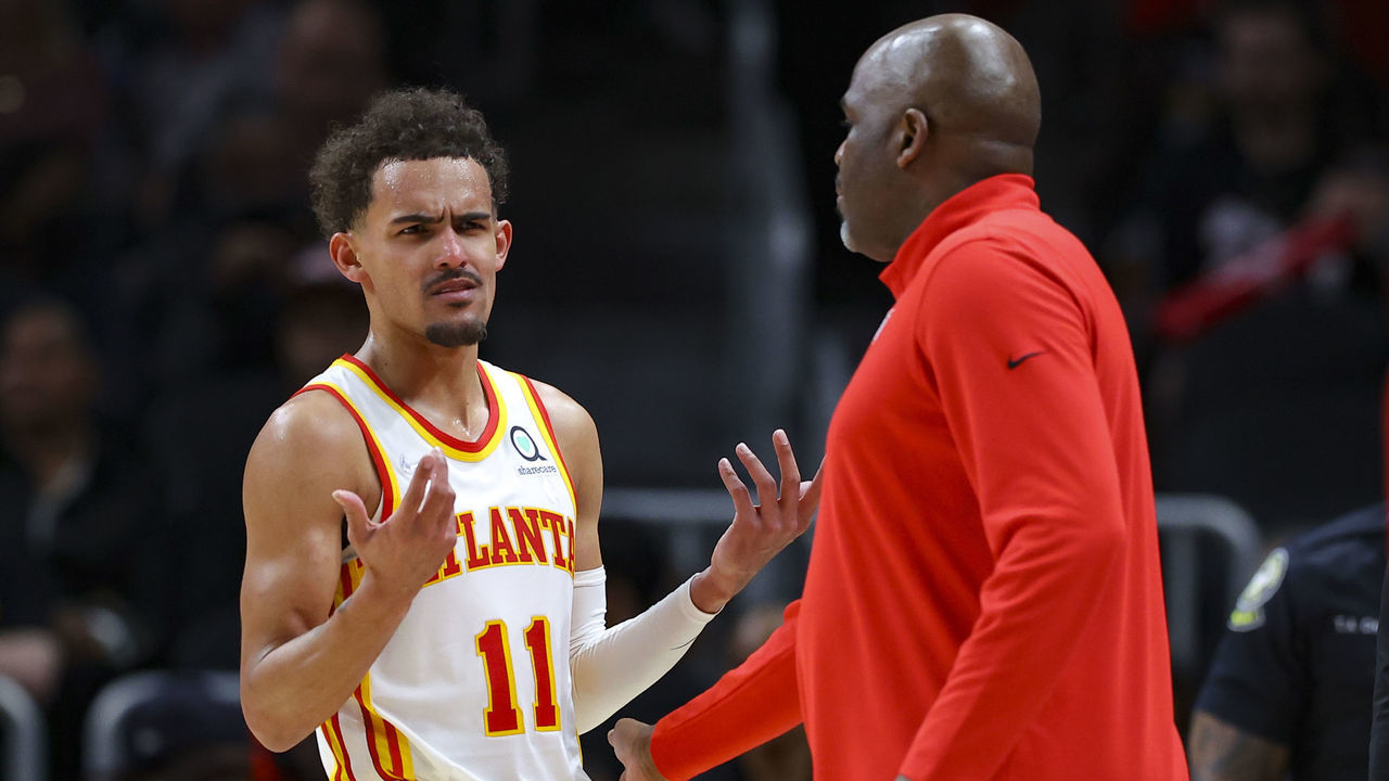 ATLANTA, GA - MARCH 31: Trae Young #11 speaks with head Coach Nate McMillan of the Atlanta Hawks during the second half against the Cleveland Cavaliers at State Farm Arena on March 31, 2022 in Atlanta, Georgia.