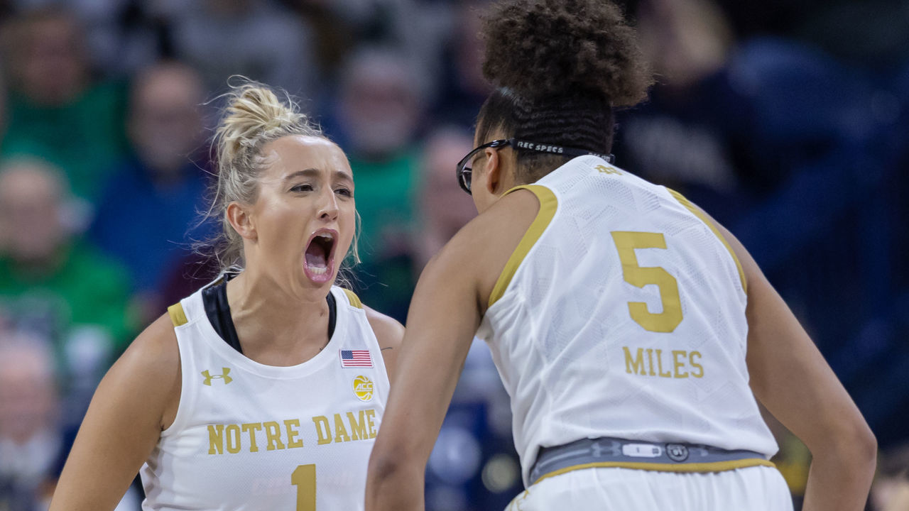 SOUTH BEND, IN - DECEMBER 04: Dara Mabrey #1 of the Notre Dame Fighting Irish and Olivia Miles #5 of the Notre Dame Fighting Irish celebrate during the first half against the UConn Huskies at Joyce Center on December 4, 2022 in South Bend, Indiana.