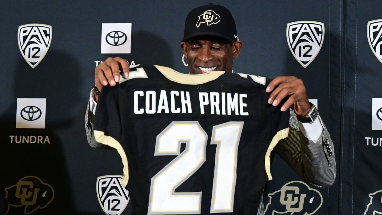 BOULDER, CO - DECEMBER 4: Deion Sanders, CUs new head football coach, holds up a personalized jersey in the Arrow Touchdown Club during a press conference on December 4, 2022 in Boulder, Colorado. CU held an introductory press conference to announce the hiring of Deion Coach Prime Sanders as the schools new head football coach. Chancellor Phil DiStefano and athletic director Rick George accompanied Sanders into a packed room in the Arrow Touchdown Club inside the Dal Ward Athletic Center. Sanders becomes the 28th head coach in Buffalo football history. Sanders, who known as Prime Time during his Hall of Fame playing career has since transitioned into Coach Prime as a head football coach. Sanders, 55, joins the CU program from Jackson State University where in three seasons the Tigers compiled a 27-5 record and won back-to-back Southwestern Athletic Conference championships.