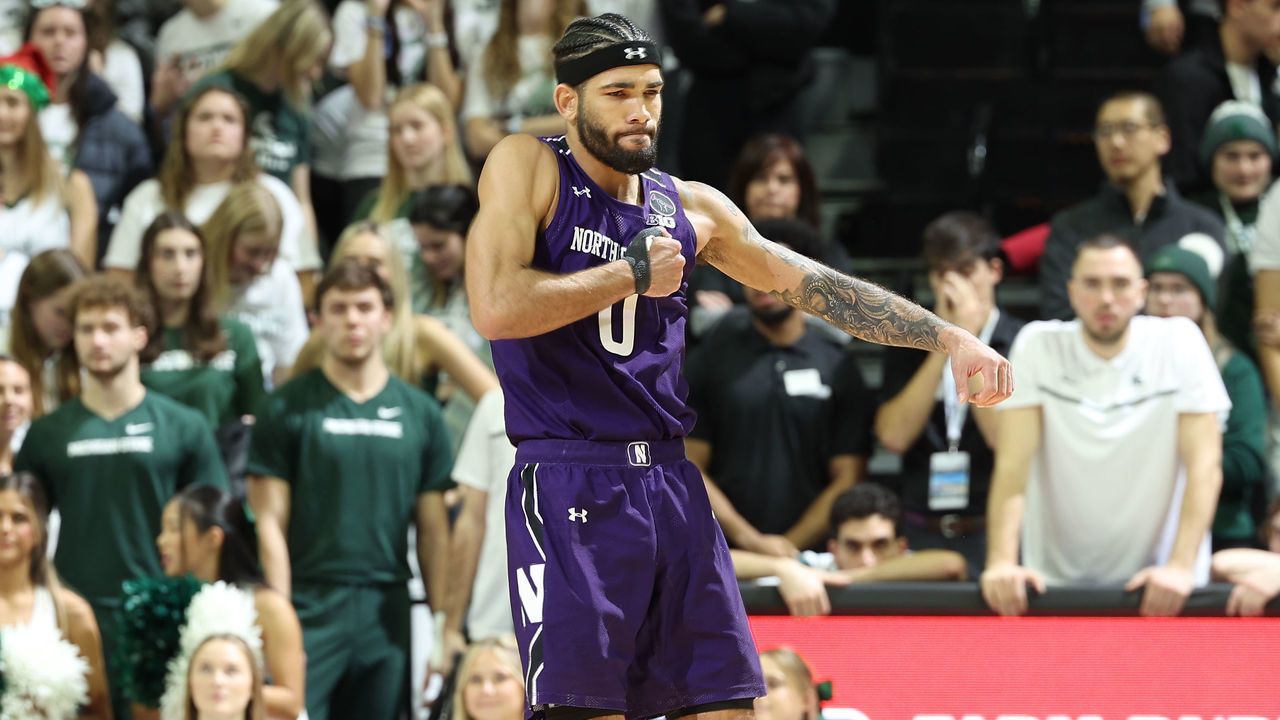 EAST LANSING, MI - DECEMBER 04: Boo Buie #0 of the Northwestern Wildcats celebrates late in the second half of the game against the Michigan State Spartans at Breslin Center on December 4, 2022 in East Lansing, Michigan.