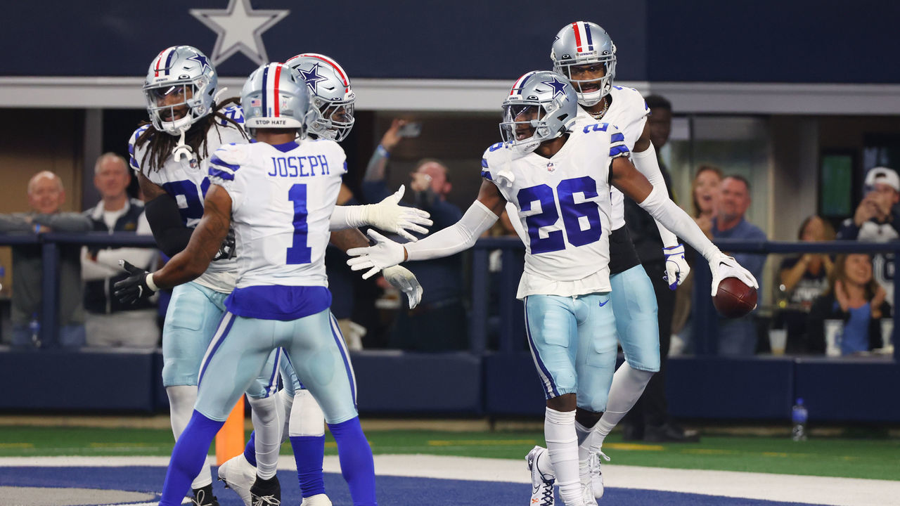 ARLINGTON, TEXAS - DECEMBER 04: DaRon Bland #26 of the Dallas Cowboys celebrates with teammates after an interception in the fourth quarter against the Indianapolis Colts at AT&T Stadium on December 04, 2022 in Arlington, Texas.