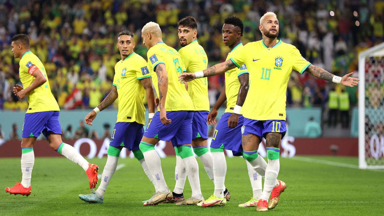 DOHA, QATAR - DECEMBER 05: Neymar of Brazil celebrates with teammates after scoring the team's second goal via a penalty during the FIFA World Cup Qatar 2022 Round of 16 match between Brazil and South Korea at Stadium 974 on December 05, 2022 in Doha, Qatar.