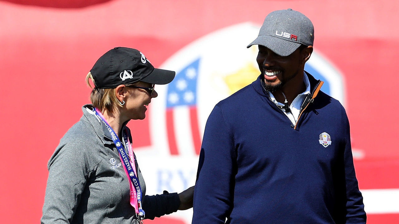 CHASKA, MN - SEPTEMBER 30: Annika Sorenstam speaks to vice-captain Tiger Woods of the United States during afternoon fourball matches of the 2016 Ryder Cup at Hazeltine National Golf Club on September 30, 2016 in Chaska, Minnesota.