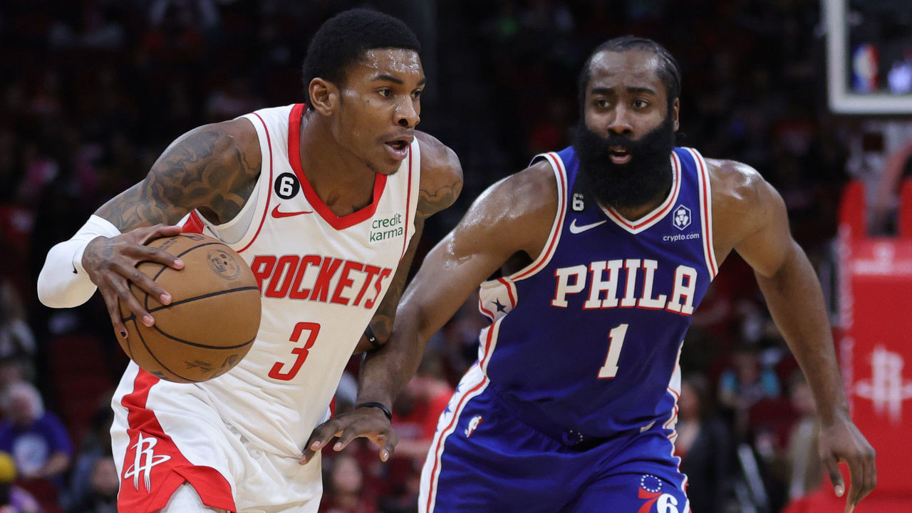 HOUSTON, TEXAS - DECEMBER 05: Kevin Porter Jr. #3 of the Houston Rockets controls the ball ahead of James Harden #1 of the Philadelphia 76ers during the first half at Toyota Center on December 05, 2022 in Houston, Texas.
