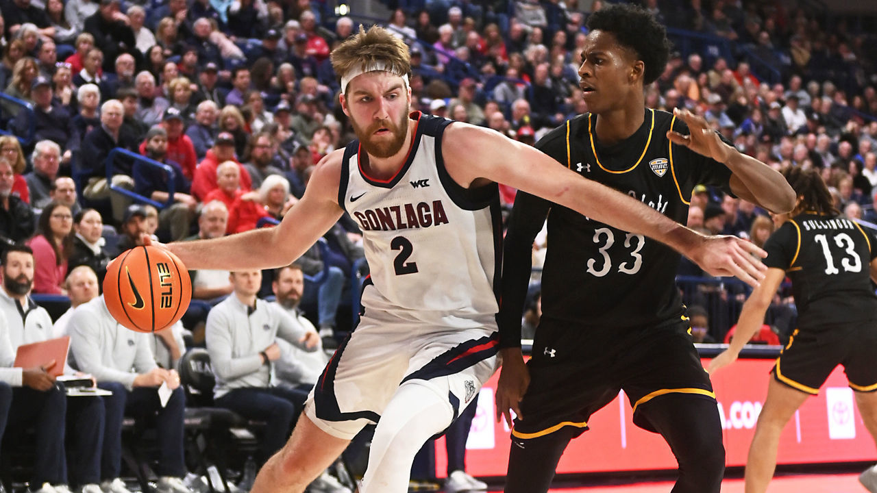 SPOKANE, WA - DECEMBER 5: Drew Timme #2 of the Gonzaga Bulldogs attempts to drive baseline against Miryne Thomas #33 of the Kent State Golden Flashes during the second half of the game at McCarthey Athletic Center on December 5, 2022 in Spokane, Washington.
