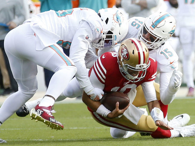 SANTA CLARA, CALIFORNIA - DECEMBER 04: San Francisco 49ers' Jimmy Garoppolo #10 is sacked in the first quarter of their NFL game against the Miami Dolphins at Levis Stadium in Santa Clara, Calif., on Sunday, Dec.4, 2022. Garoppolo fractured his foot on the play. (Jane Tyska/Digital First Media/East Bay Times via Getty Images)