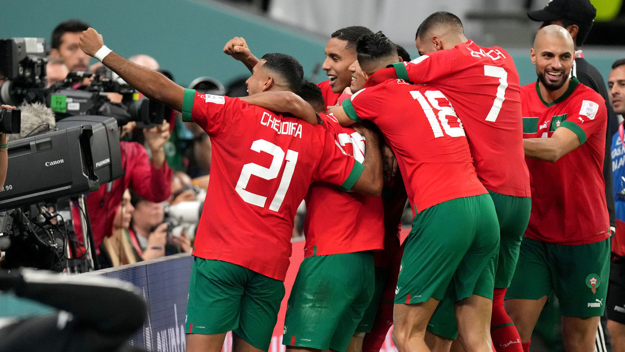 AL RAYYAN, QATAR - DECEMBER 06: Achraf Hakimi and Abdelhamid Sabiri of Morocco celebrates with team mates for the victory after scoring the last penalty ,during the FIFA World Cup Qatar 2022 Round of 16 match between Morocco and Spain at Education City Stadium on December 6, 2022 in Al Rayyan, Qatar.
