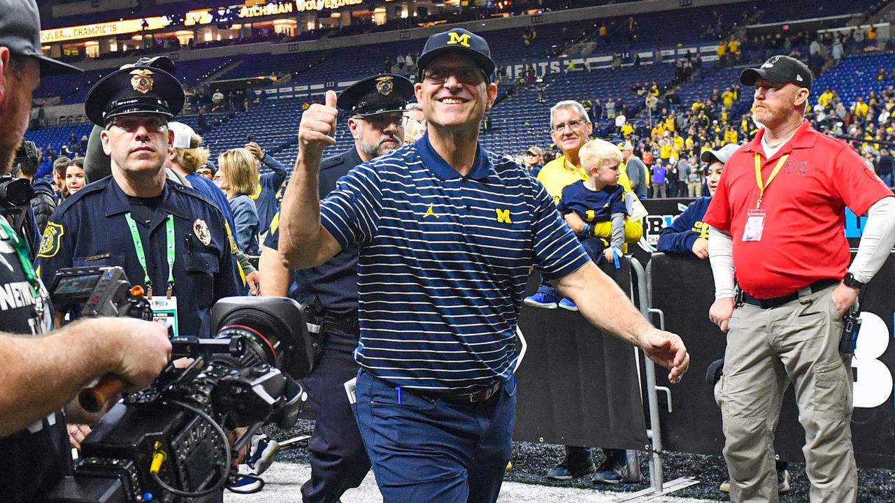 INDIANAPOLIS, INDIANA - DECEMBER 03: Head Football Coach Jim Harbaugh of the Michigan Wolverines reacts as he walks off the field after winning the Big Ten football championship game against the Purdue Boilermakers at Lucas Oil Stadium on December 03, 2022 in Indianapolis, Indiana. The Michigan Wolverines won the game 43-22 over the Purdue Boilermakers.