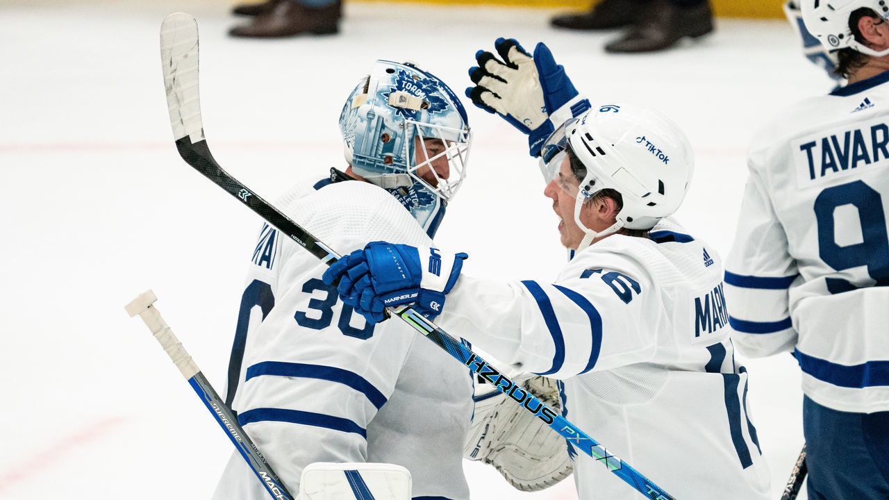 DALLAS, TEXAS - DECEMBER 06: Matt Murray #30 of the Toronto Maple Leafs is congratulated by teammate Mitchell Marner #16 after their game against the Dallas Stars at American Airlines Center on December 06, 2022 in Dallas, Texas.