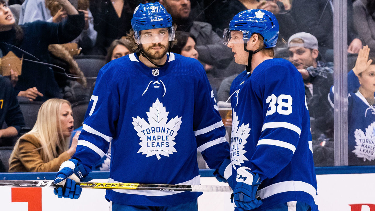 TORONTO, ON - FEBRUARY 7: Rasmus Sandin #38 of the Toronto Maple Leafs talks to Timothy Liljegren #37 at an NHL game against the Anaheim Ducks at the Scotiabank Arena on February 7, 2020 in Toronto, Ontario, Canada.