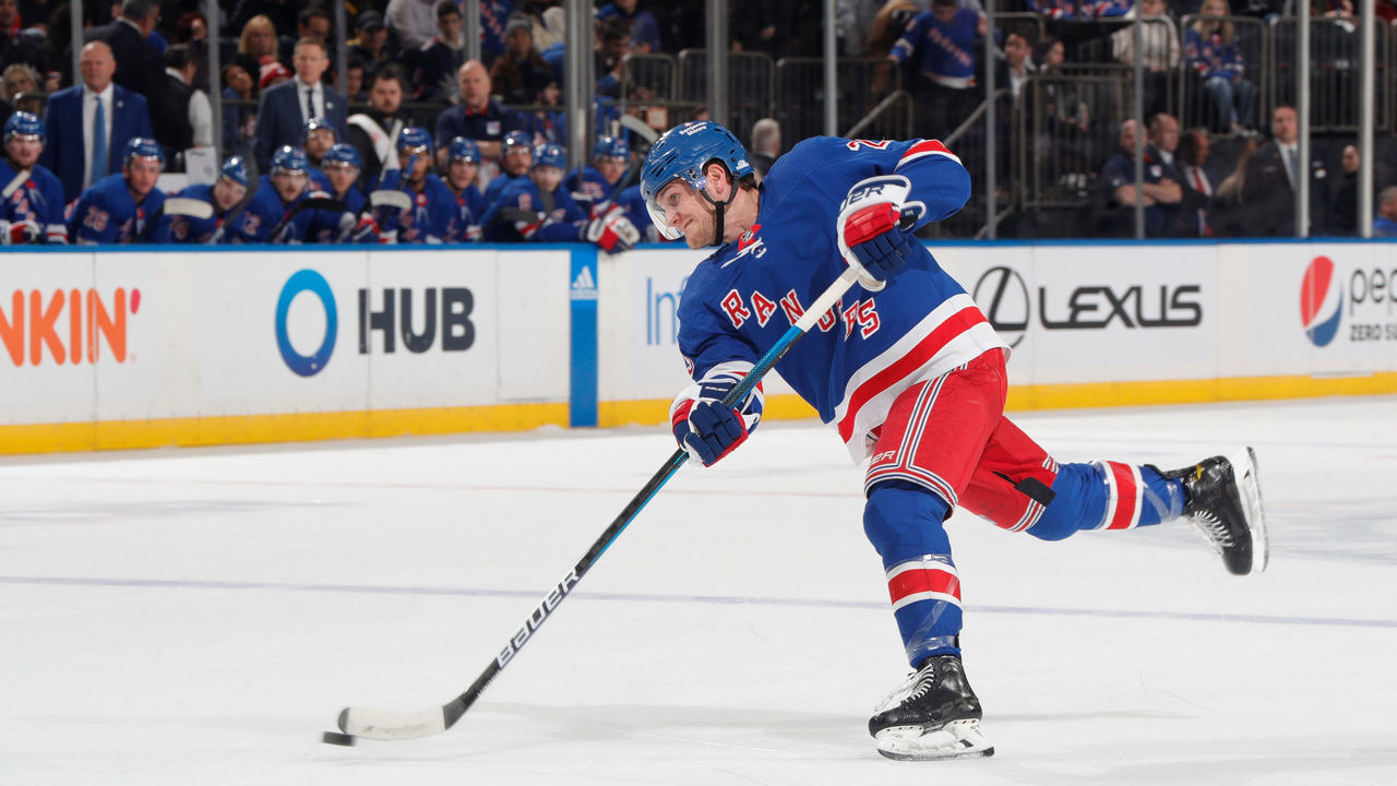 NEW YORK, NEW YORK - DECEMBER 05: Adam Fox #23 of the New York Rangers shoots and scores in the first period against the St Louis Blues at Madison Square Garden on December 5, 2022 in New York City.