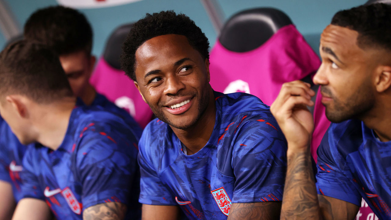 DOHA, QATAR - NOVEMBER 29: Raheem Sterling and Callum Wilson of England look on from the bench prior to the FIFA World Cup Qatar 2022 Group B match between Wales and England at Ahmad Bin Ali Stadium on November 29, 2022 in Doha, Qatar.