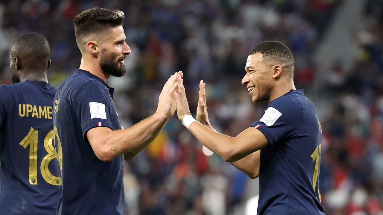 Kylian Mbappe R of France celebrates his goal with teammate Olivier Giroud C during the Round of 16 match between France and Poland of the 2022 FIFA World Cup at Al Thumama Stadium in Doha, Qatar, Dec. 4, 2022.