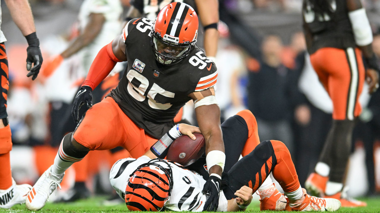 CLEVELAND, OHIO - OCTOBER 31: Myles Garrett #95 of the Cleveland Browns sacks Joe Burrow #9 of the Cincinnati Bengals during the second half at FirstEnergy Stadium on October 31, 2022 in Cleveland, Ohio.