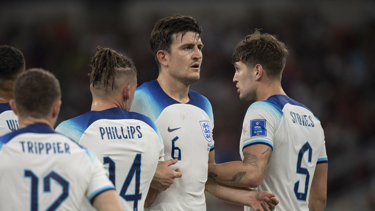 DOHA, QATAR - NOVEMBER 29: Harry Maguire of England helps to build a defensive wall with team mates Kieran Trippier, Callum Wilson, Kalvin Phillips and John Stones during the FIFA World Cup Qatar 2022 Group B match between Wales and England at Ahmad Bin Ali Stadium on November 29, 2022 in Doha, Qatar.