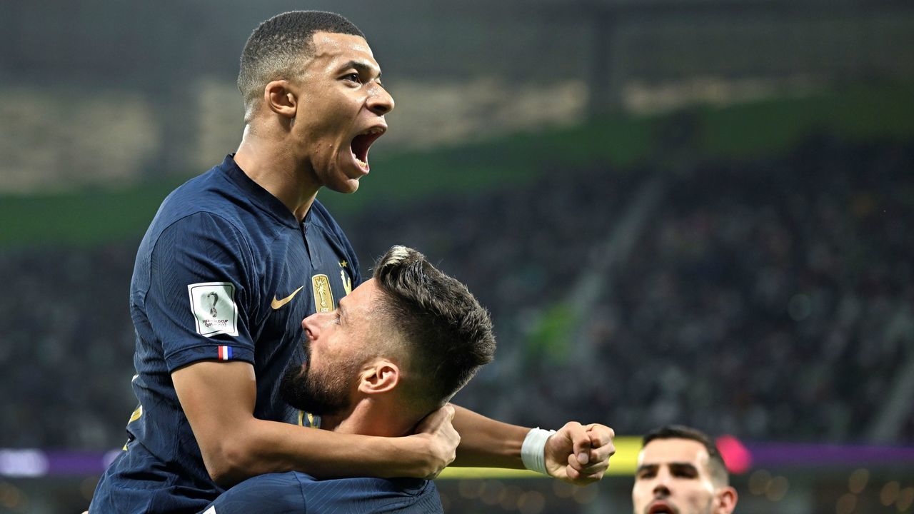 Olivier Giroud 2nd R of France celebrates his goal with teammate Kylian Mbappe 1st L during the Round of 16 match between France and Poland of the 2022 FIFA World Cup at Al Thumama Stadium in Doha, Qatar, Dec. 4, 2022.