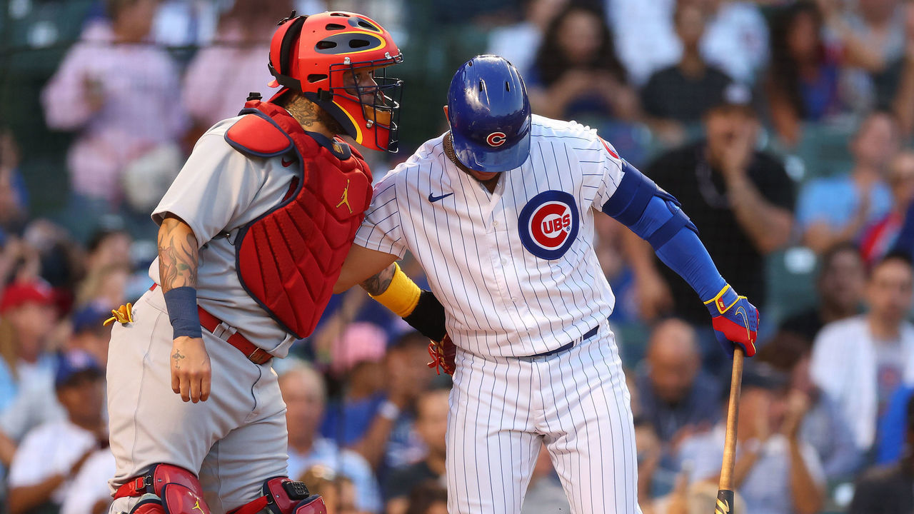 CHICAGO, ILLINOIS - AUGUST 22: Willson Contreras #40 of the Chicago Cubs greets Yadier Molina #4 of the St. Louis Cardinals during the first inning at Wrigley Field on August 22, 2022 in Chicago, Illinois.