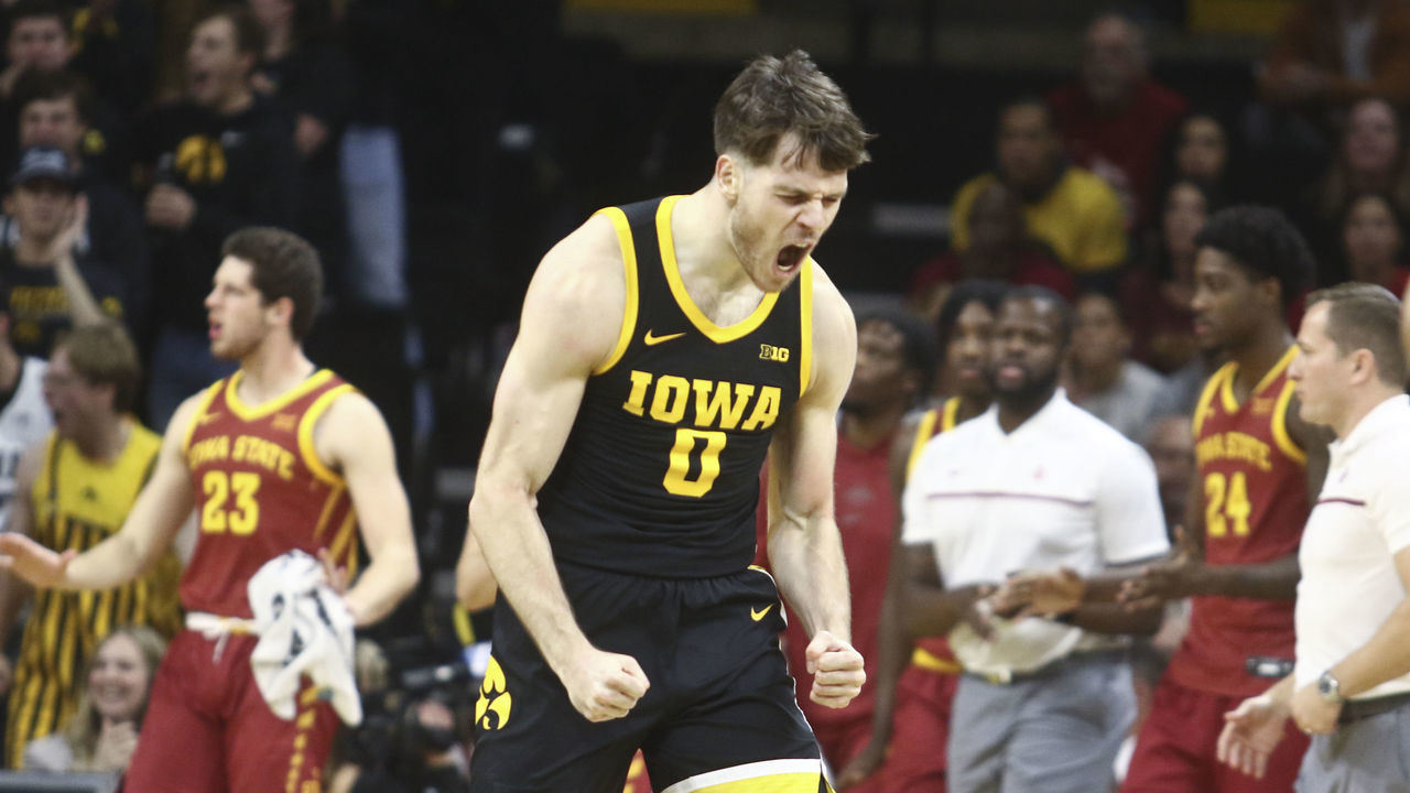 IOWA CITY, IOWA- DECEMBER 08: Forward Filip Rebraca #0 of the Iowa Hawkeyes celebrates after a 3-pt basket during the first half against the Iowa State Cyclones at Carver-Hawkeye Arena, on December 8, 2022 in Iowa City, Iowa.
