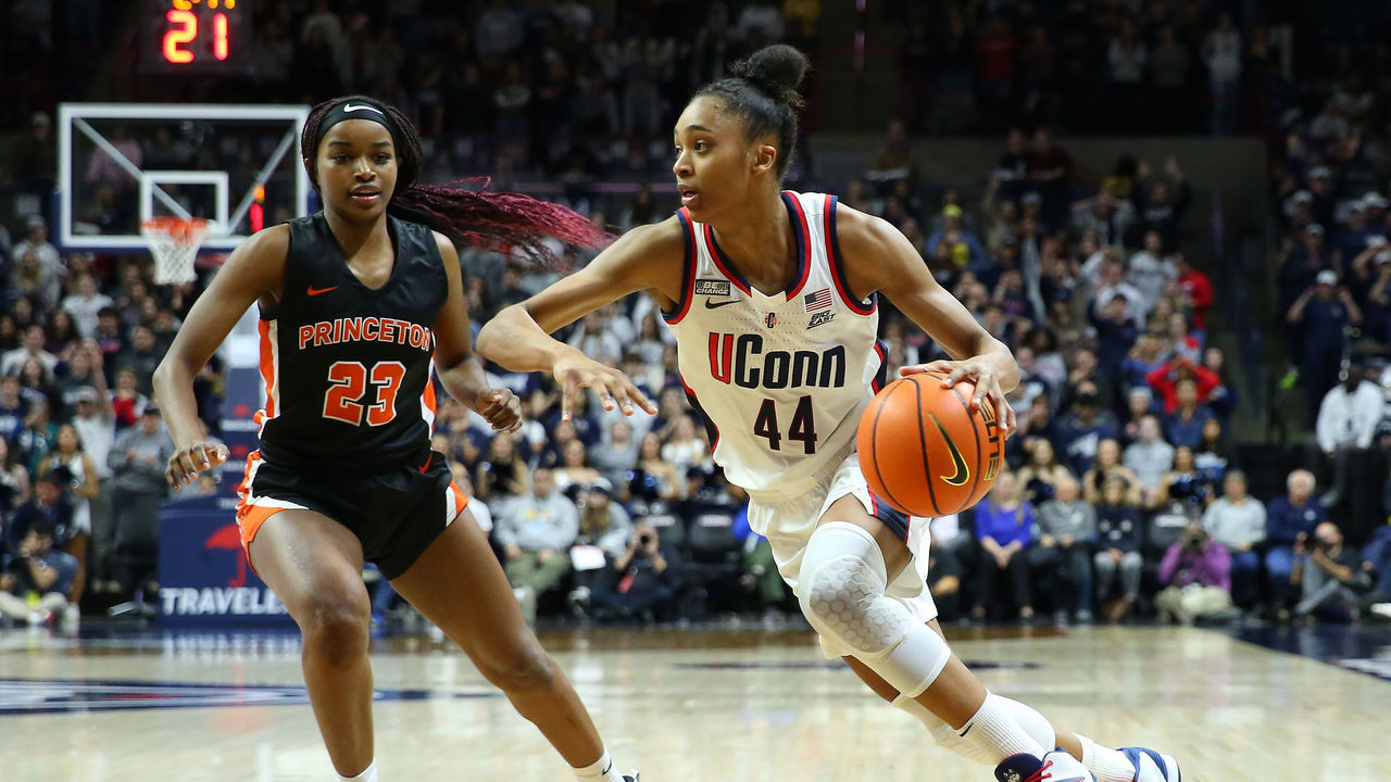 STORRS, CT - DECEMBER 08: UConn Huskies forward Aubrey Griffin (44) drives past Princeton Tigers guard Madison St. Rose (23) during the women's college basketball game between Princeton Tigers and UConn Huskies on December 8, 2022, at Harry A. Gampel Pavilion in Storrs, CT.