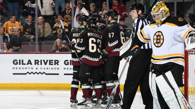 TEMPE, ARIZONA - DECEMBER 09: Matias Maccelli #63, Lawson Crouse #67, and JJ Moser #90 of the Arizona Coyotes celebrate after a goal during the first period against the Boston Bruins at Mullett Arena on December 09, 2022 in Tempe, Arizona.